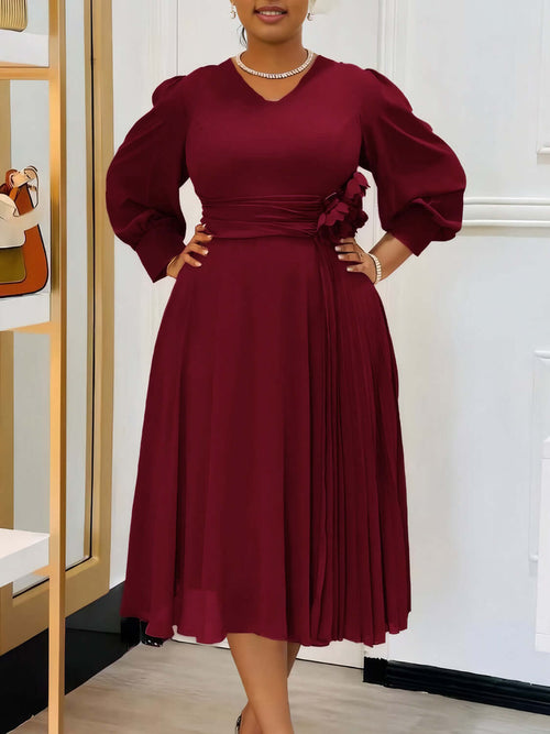 Robe coupe A élégante en couleur sable avec manches bouffantes et détails plissés, parfaite pour toutes les silhouettes.