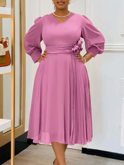 Robe coupe A élégante en couleur sable avec manches bouffantes et détails plissés, parfaite pour toutes les silhouettes.
