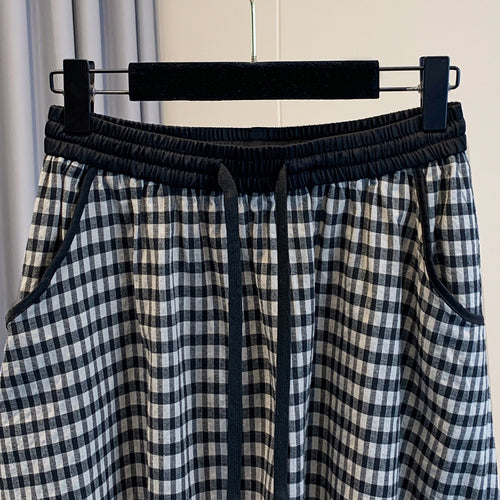 Jupe femme à carreaux rétro, loose et casual, avec taille élastique et lacets, idéale pour l'été.