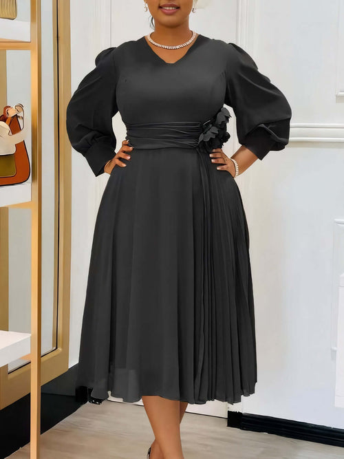 Robe coupe A élégante en couleur sable avec manches bouffantes et détails plissés, parfaite pour toutes les silhouettes.