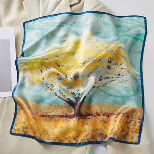 Carré de soie 100 pourcent véritable, foulard polyvalent aux couleurs vibrantes sur un livre.
