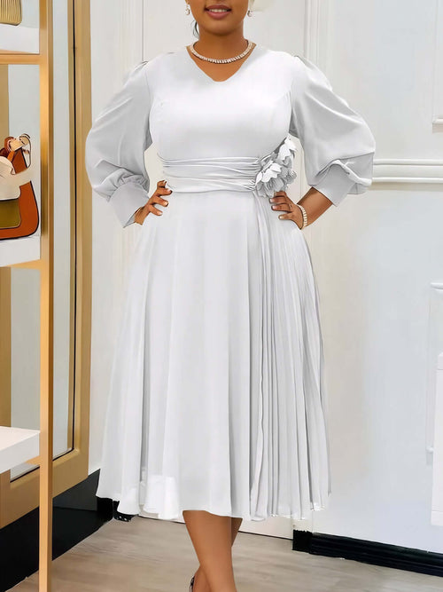 Robe coupe A élégante en couleur sable avec manches bouffantes et détails plissés, parfaite pour toutes les silhouettes.