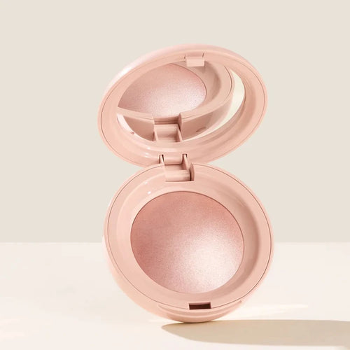 Stick Contouring nacré & Illuminateur – Contrôle Sébum by Rare Beauty in various shades displayed on a vanity.