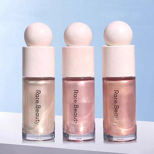 Luminizer & Blush Mat Longue Tenue - Waterproof in a set of four Rare Beauty products on a table.