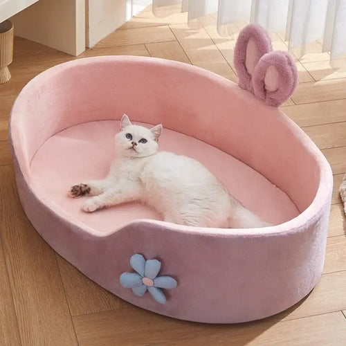 Lit détachable et lavable pour chien et cha - Un chien heureux se détend dans un lit doux et chaud.