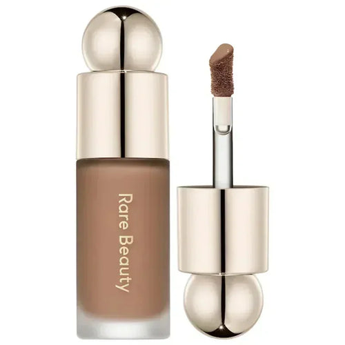 Luminizer & Blush Mat Longue Tenue - Waterproof in a set of four Rare Beauty products on a table.