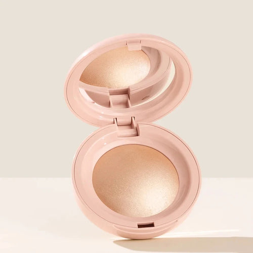 Stick Contouring nacré & Illuminateur – Contrôle Sébum by Rare Beauty in various shades displayed on a vanity.
