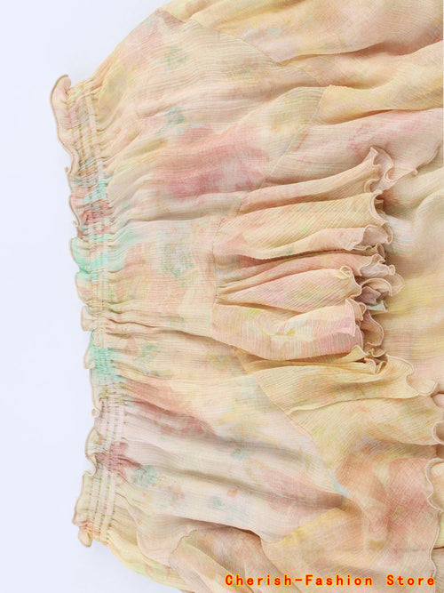 Jupe trapèze dentelle florale avec volants, design romantique, longueur mi-longue, en polyester fluide.
