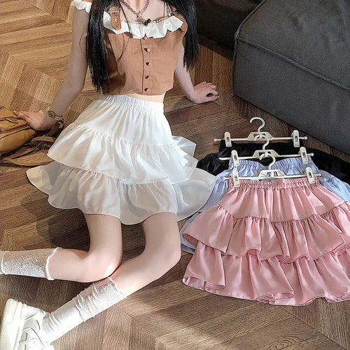 Jupe gâteau à volants taille haute en blanc, rose, bleu et noir, mode Kawaii, style printanier.