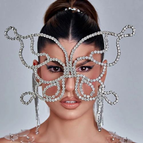 Voile masque papillon strass femme worn by model, showcasing its intricate design and elegance for masquerade events.